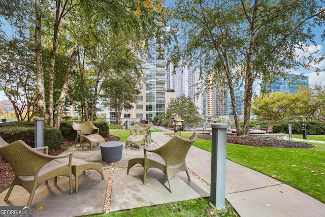 950 W Peachtree St NW Unit 1214, Atlanta, GA 30309 - surrounding community with a yard and a patio area