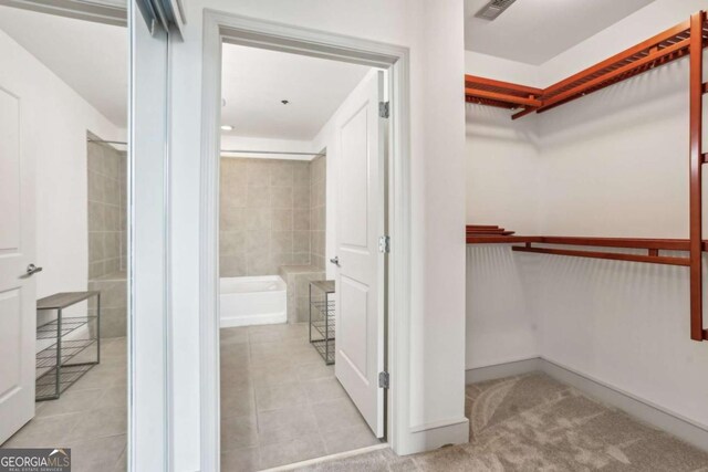 950 W Peachtree St NW Unit 1214, Atlanta, GA 30309 - walk in closet featuring tile patterned flooring and visible vents