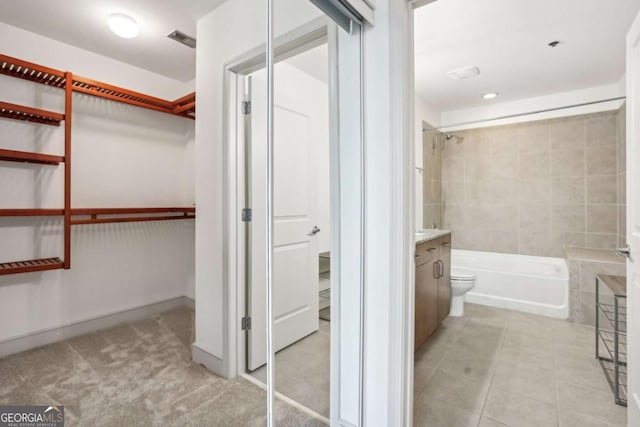 950 W Peachtree St NW Unit 1214, Atlanta, GA 30309 - bathroom with shower / bath combination, vanity, a spacious closet, and visible vents