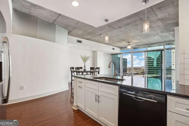 950 W Peachtree St NW Unit 1214, Atlanta, GA 30309 - kitchen with a sink, dishwasher, dark wood-style flooring, white cabinetry, and a ceiling fan