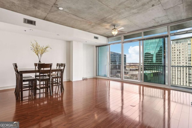 950 W Peachtree St NW Unit 1214, Atlanta, GA 30309 - dining space featuring ceiling fan, visible vents, floor to ceiling windows, and wood finished floors