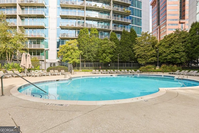 950 W Peachtree St NW Unit 1214, Atlanta, GA 30309 - pool with fence and a patio area