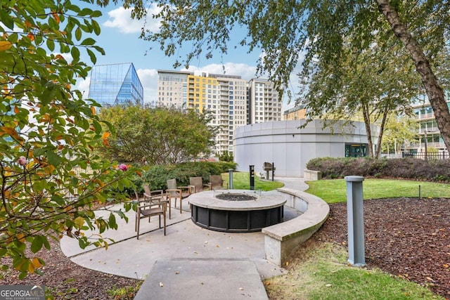 950 W Peachtree St NW Unit 1214, Atlanta, GA 30309 - view of home's community with an outdoor fire pit and a patio area