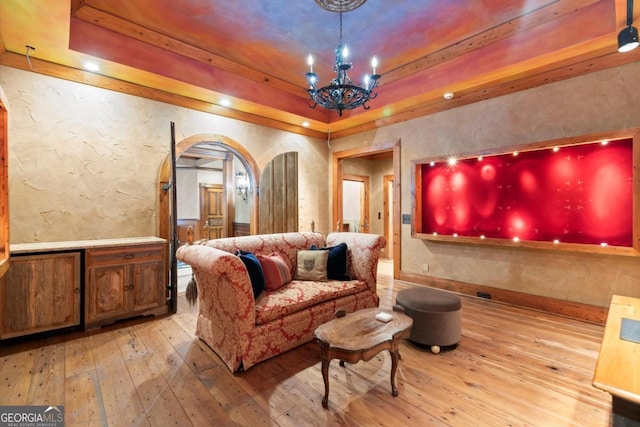 3863 Streamside Dr SE, Marietta, GA 30067 - cinema with a raised ceiling, a chandelier, wood-type flooring, and a textured wall