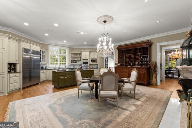 3863 Streamside Dr SE, Marietta, GA 30067 - dining space featuring recessed lighting, crown molding, light wood-style flooring, and a notable chandelier
