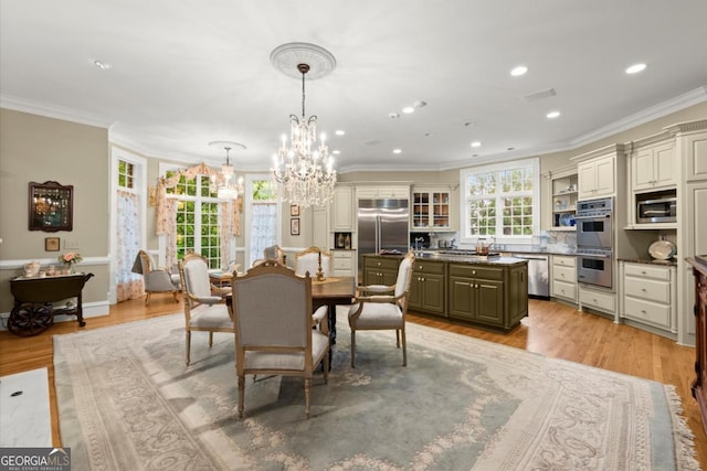 3863 Streamside Dr SE, Marietta, GA 30067 - dining area featuring a chandelier, crown molding, light wood finished floors, and recessed lighting