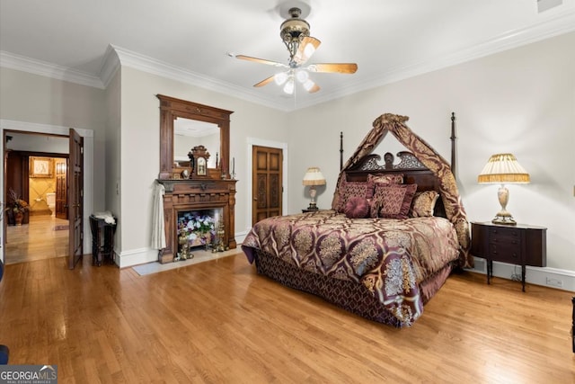 3863 Streamside Dr SE, Marietta, GA 30067 - bedroom featuring crown molding, baseboards, ceiling fan, and wood finished floors