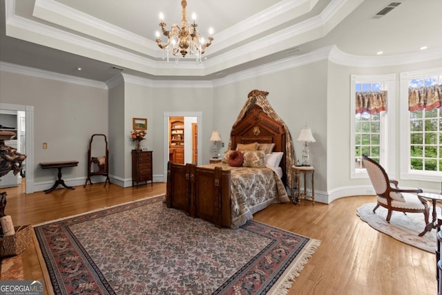 3863 Streamside Dr SE, Marietta, GA 30067 - bedroom with a raised ceiling, a notable chandelier, hardwood / wood-style floors, and visible vents