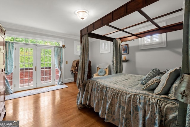3863 Streamside Dr SE, Marietta, GA 30067 - bedroom featuring multiple windows, access to outside, wood finished floors, and crown molding