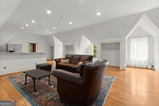 3863 Streamside Dr SE, Marietta, GA 30067 - living room featuring vaulted ceiling, recessed lighting, baseboards, and light wood-style floors