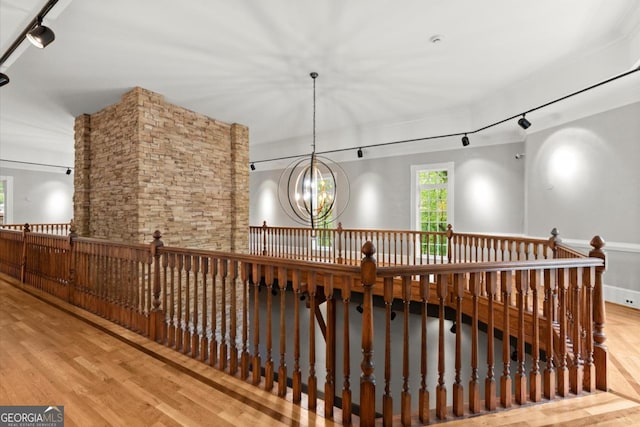 3863 Streamside Dr SE, Marietta, GA 30067 - interior space with an upstairs landing, rail lighting, a chandelier, and wood finished floors