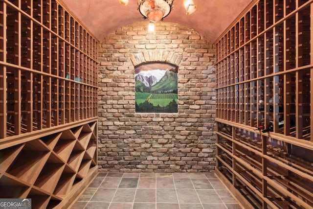 3863 Streamside Dr SE, Marietta, GA 30067 - wine cellar with brick wall, lofted ceiling, and stone finish floor