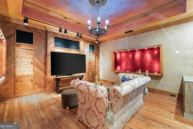 3863 Streamside Dr SE, Marietta, GA 30067 - home theater room with a notable chandelier, visible vents, track lighting, and hardwood / wood-style flooring