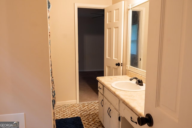 bathroom featuring vanity and baseboards