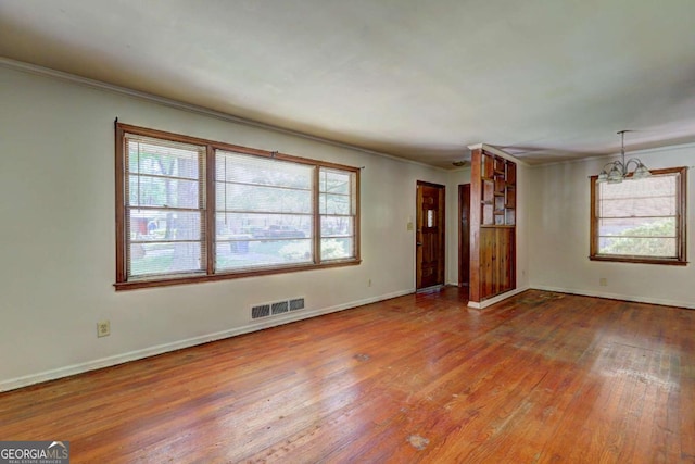 1815 Windsor Dr SW, Atlanta, GA 30311 - unfurnished living room featuring plenty of natural light, visible vents, and hardwood / wood-style floors