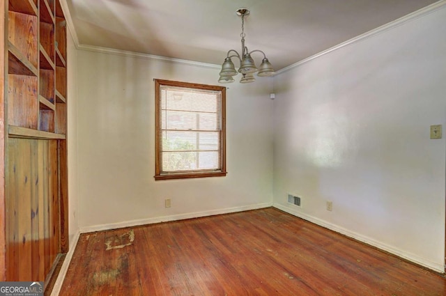 1815 Windsor Dr SW, Atlanta, GA 30311 - unfurnished room with wood finished floors, baseboards, visible vents, crown molding, and a notable chandelier