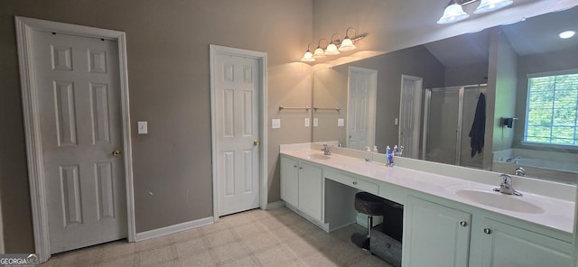 7491 Hilltop Way, Atlanta, GA 30349 - bathroom with double vanity, a stall shower, a garden tub, and tile patterned floors
