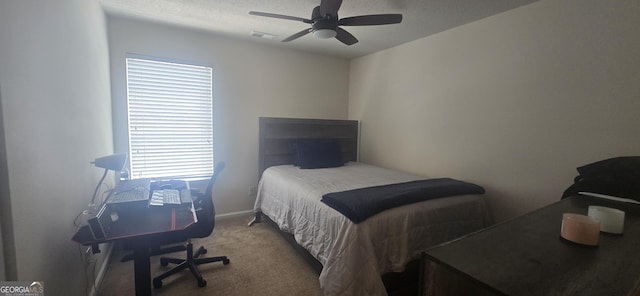 7491 Hilltop Way, Atlanta, GA 30349 - bedroom with carpet floors, a ceiling fan, and a textured ceiling