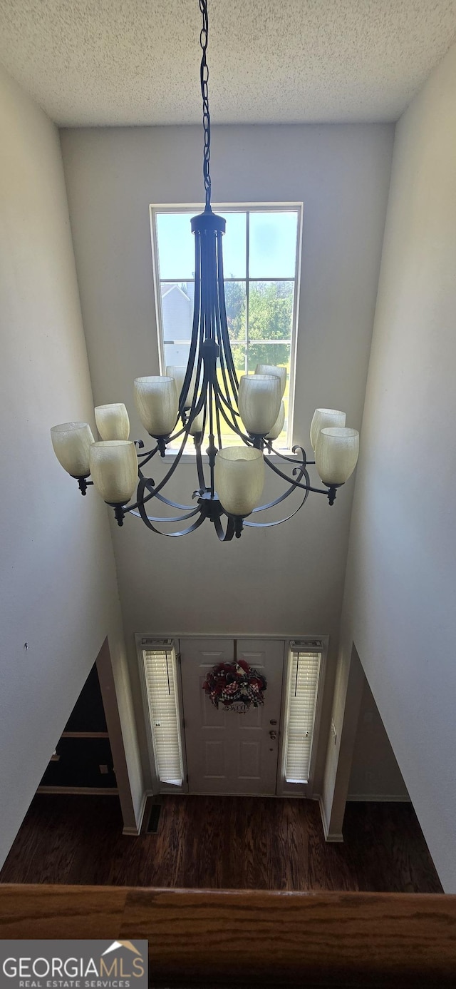 7491 Hilltop Way, Atlanta, GA 30349 - detailed view of wood finished floors and a chandelier