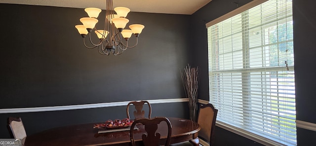 7491 Hilltop Way, Atlanta, GA 30349 - dining room featuring plenty of natural light and a chandelier