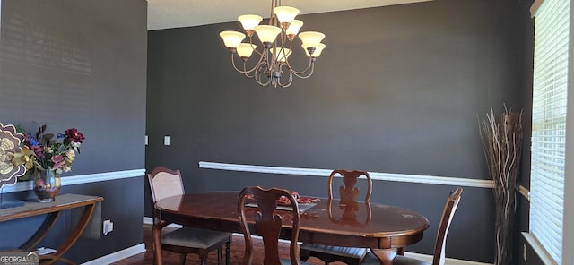 7491 Hilltop Way, Atlanta, GA 30349 - dining area featuring a chandelier and wood finished floors