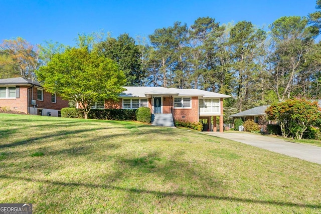 1468 N Amanda Cir, Atlanta, GA 30329 - view of front of property with a carport, a front lawn, brick siding, and driveway