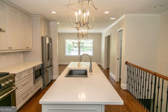 1468 N Amanda Cir, Atlanta, GA 30329 - kitchen featuring a sink, high quality appliances, a notable chandelier, a center island with sink, and light countertops