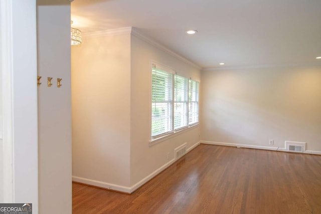 1468 N Amanda Cir, Atlanta, GA 30329 - spare room with visible vents, wood finished floors, baseboards, and ornamental molding