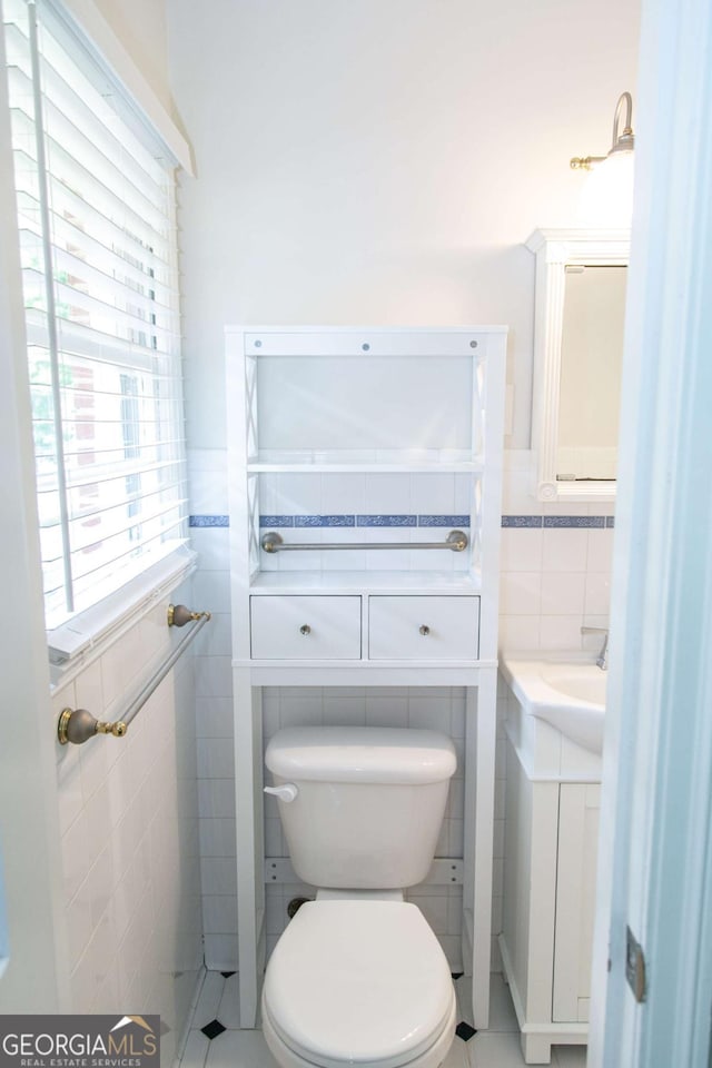 1468 N Amanda Cir, Atlanta, GA 30329 - half bath with toilet, tile walls, vanity, and wainscoting
