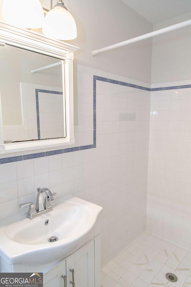 1468 N Amanda Cir, Atlanta, GA 30329 - bathroom featuring vanity, tile walls, and tiled shower