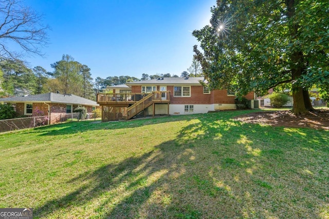 1468 N Amanda Cir, Atlanta, GA 30329 - back of house featuring a lawn, brick siding, fence, stairway, and a wooden deck
