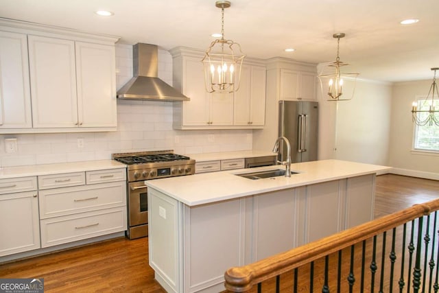 1468 N Amanda Cir, Atlanta, GA 30329 - kitchen featuring a notable chandelier, dark wood finished floors, a sink, high quality appliances, and wall chimney exhaust hood