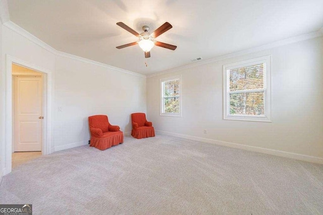 unfurnished room with ornamental molding, baseboards, a ceiling fan, and visible vents