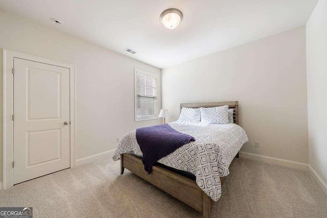 bedroom featuring baseboards, visible vents, and carpet floors