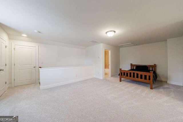 unfurnished bedroom featuring baseboards, recessed lighting, and light colored carpet