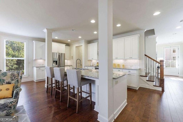kitchen with white cabinetry, a sink, and dark wood-style floors