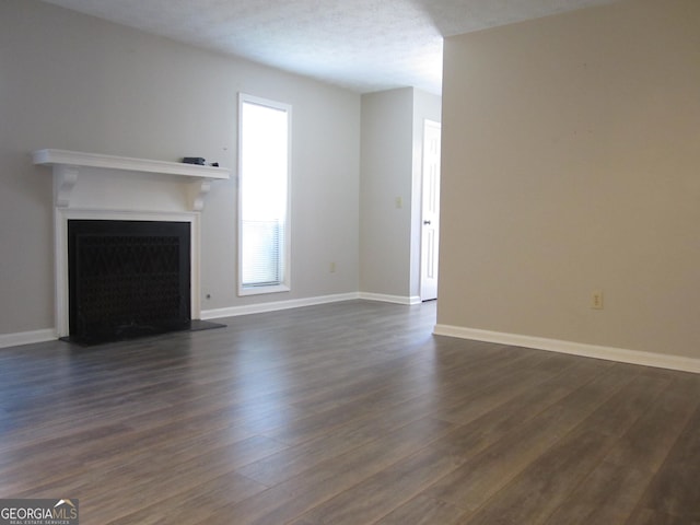 4018 Woodridge Way, Tucker, GA 30084 - unfurnished living room with a fireplace, baseboards, and dark wood finished floors