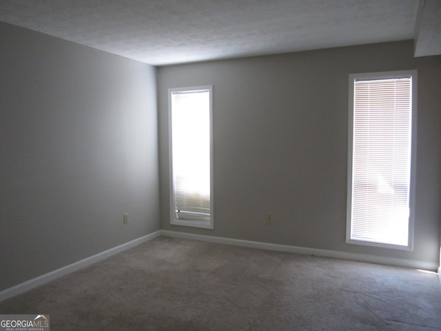 4018 Woodridge Way, Tucker, GA 30084 - spare room featuring baseboards and light carpet
