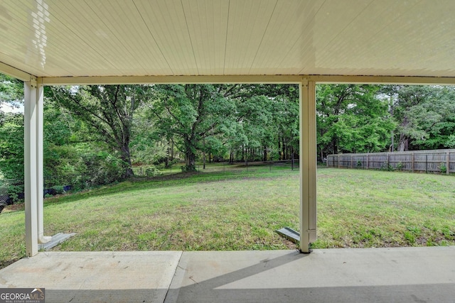 view of yard featuring a patio area and a fenced backyard
