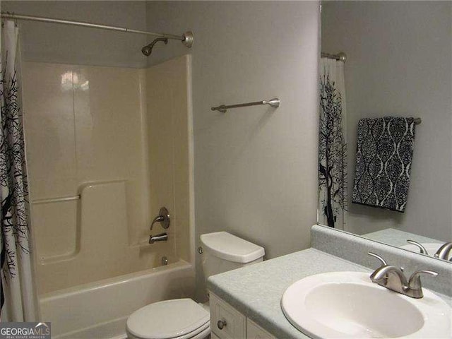 full bath featuring shower / bath combination with curtain, toilet, and vanity