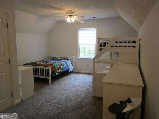 bedroom with vaulted ceiling, a textured ceiling, and carpet