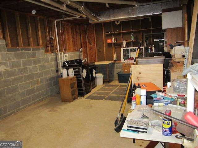 unfinished basement with concrete block wall