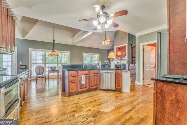 kitchen featuring appliances with stainless steel finishes, a ceiling fan, lofted ceiling, brown cabinets, and light wood-style flooring