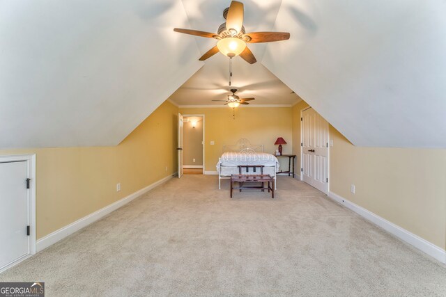 additional living space featuring ceiling fan, lofted ceiling, carpet floors, and baseboards