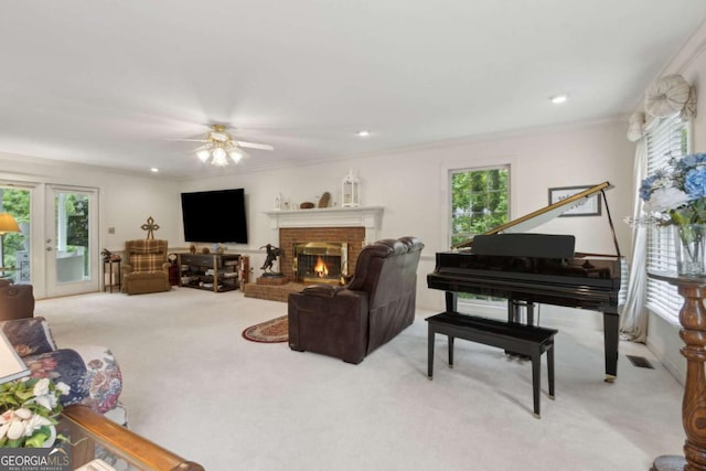 living area featuring a wealth of natural light and carpet
