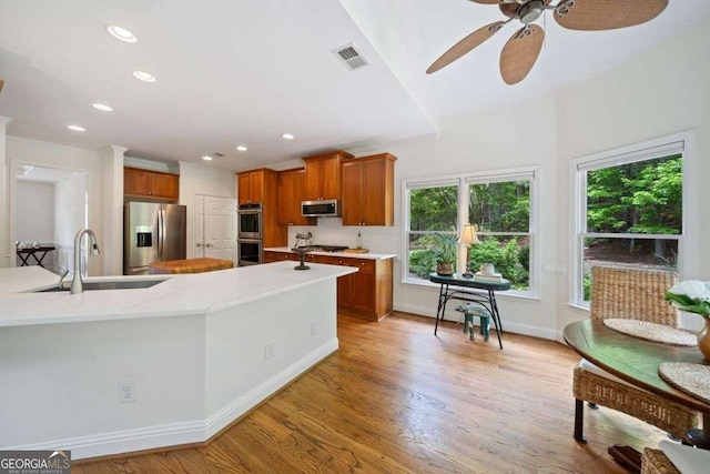 295 River Laurel Way, Woodstock, GA 30188 - kitchen featuring a healthy amount of sunlight, visible vents, appliances with stainless steel finishes, and a sink