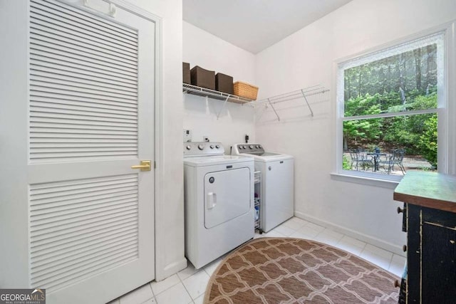 295 River Laurel Way, Woodstock, GA 30188 - laundry area featuring light tile patterned floors, separate washer and dryer, laundry area, and baseboards