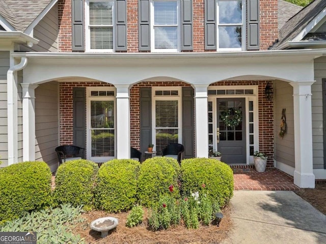 295 River Laurel Way, Woodstock, GA 30188 - doorway to property with covered porch and brick siding
