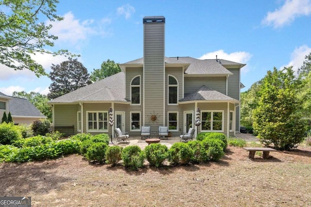 295 River Laurel Way, Woodstock, GA 30188 - back of property with a patio and a chimney