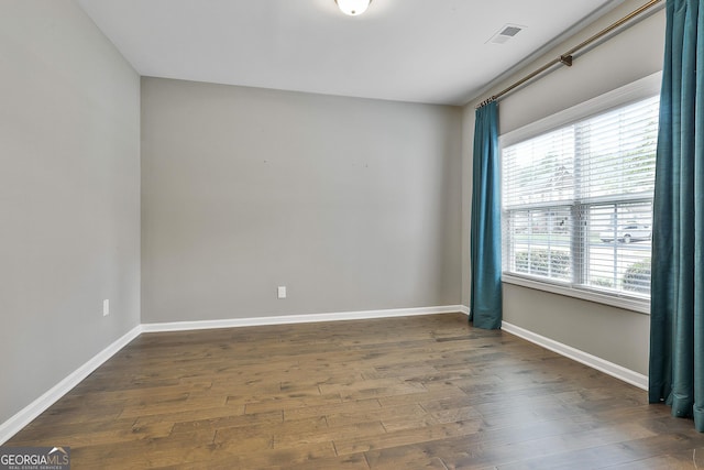 70 Pacific Ave, Sharpsburg, GA 30277 - unfurnished room featuring dark wood-style flooring and baseboards